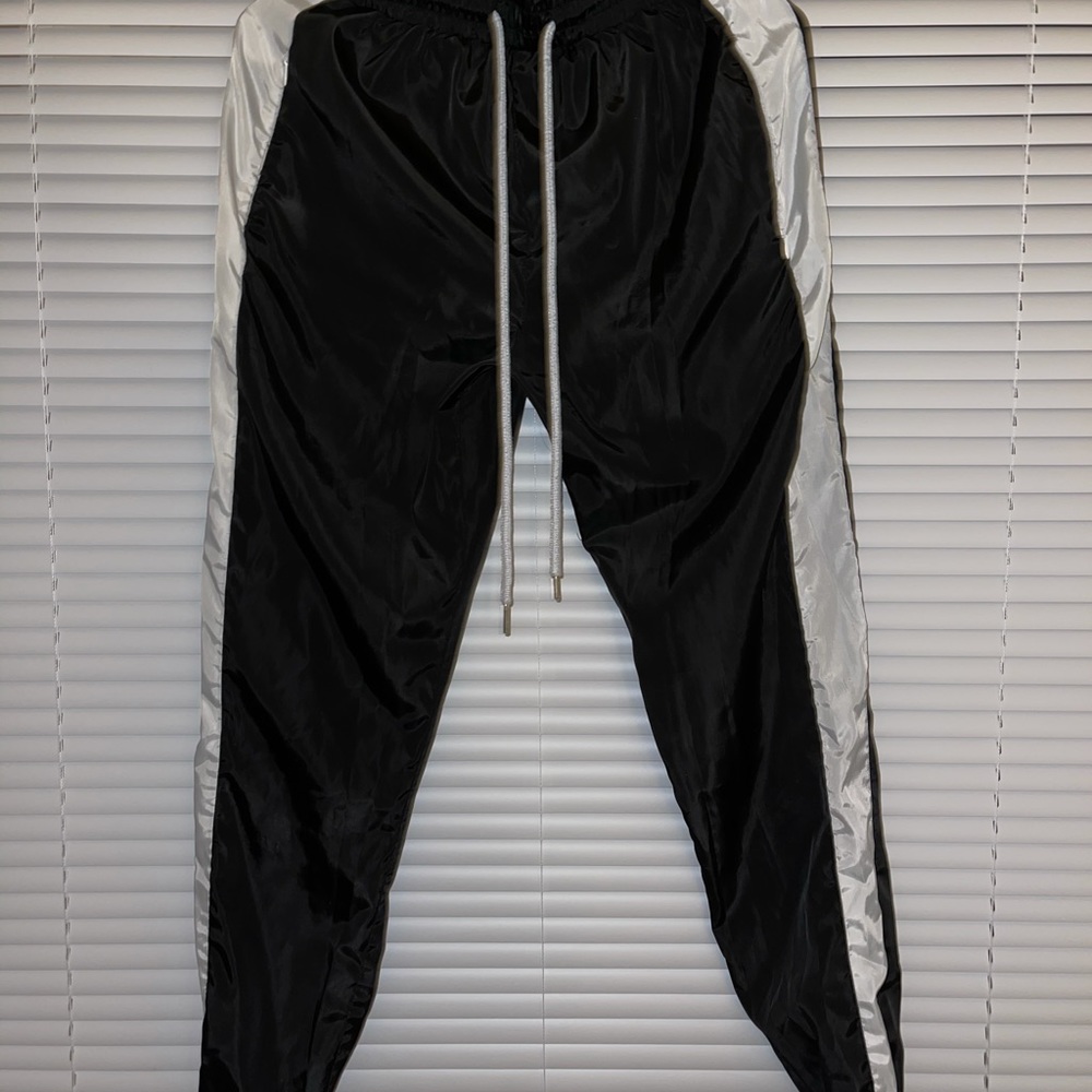 Black and white windbreaker material jogger pants